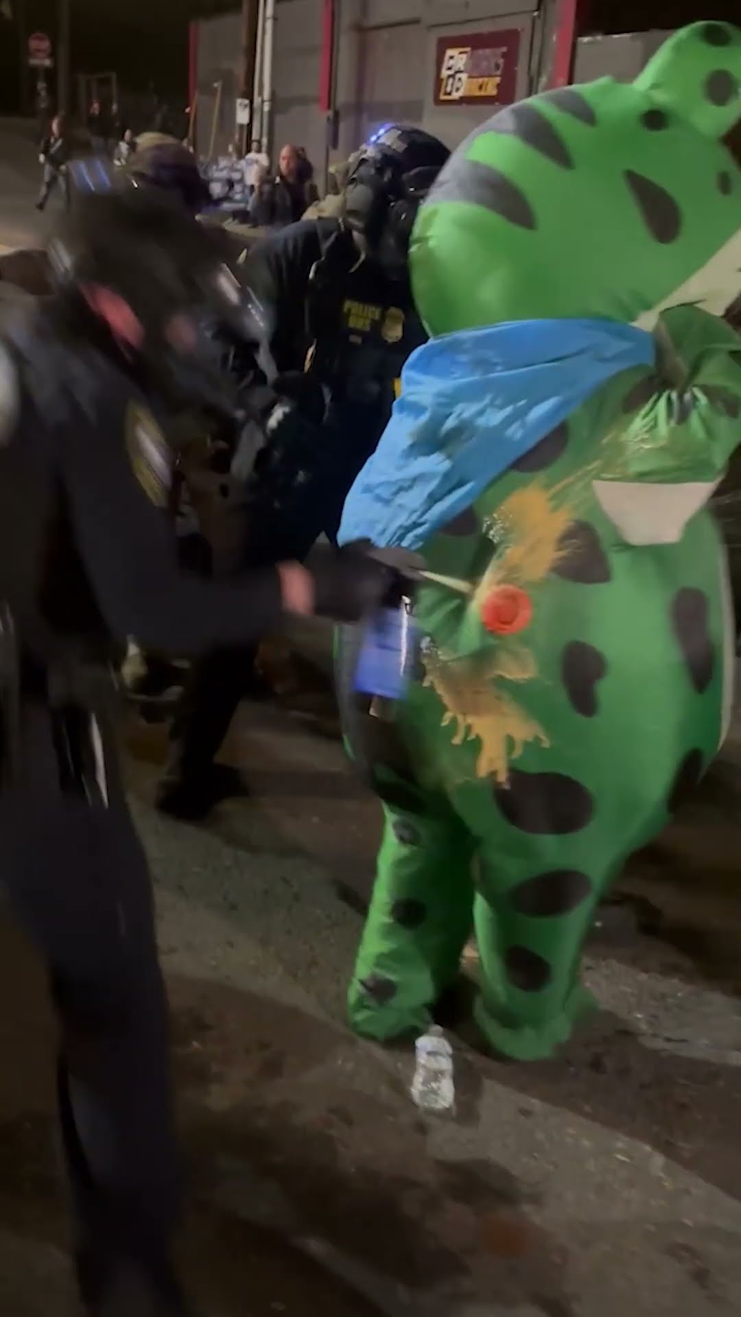 ICE Agents Shoot Pepper Spray into Protester's Frog Costume Air Vent #shorts – YouTube